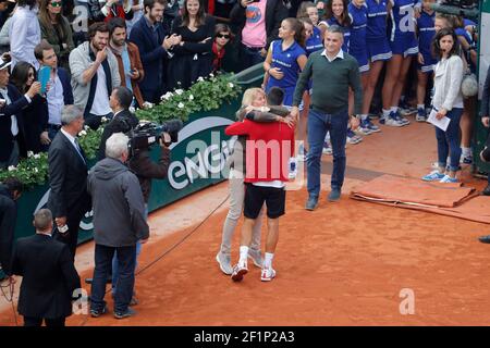 Novak DJOKOVIC (SRB) in arms of his mother Dijana Djokovic, his father Srdjan Djokovic (in the background) during the Roland Garros French Tennis Open 2016, Final single Men, on June 5, 2016, at the Roland Garros Stadium in Paris, France - Photo Stephane Allaman / DPPI Stock Photo