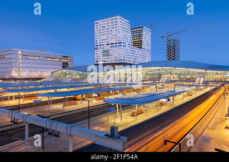 Utrecht, Netherlands cityscape over train station platforms at dawn. Stock Photo