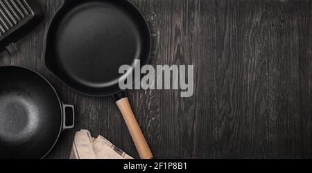 Empty cast iron frying pan. Top view with copy space Stock Photo