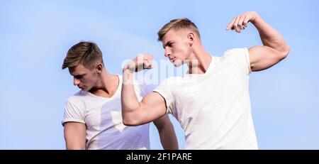 https://l450v.alamy.com/450v/2f1pare/attractive-twins-sport-lifestyle-and-healthy-body-men-twins-brothers-muscular-guys-sky-background-men-strong-muscular-athlete-bodybuilder-posing-confidently-in-white-shirts-brother-always-support-2f1pare.jpg