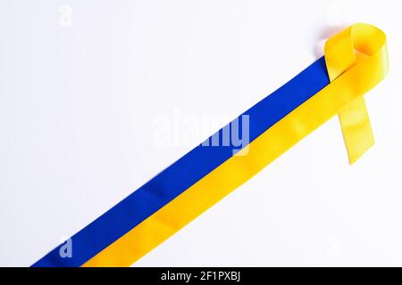 The Blue and yellow ribbon for World Down Syndrome Day Stock Photo - Alamy