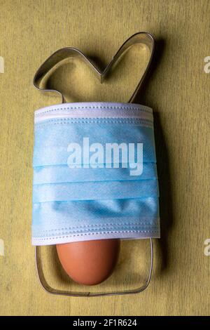 Easter bunny baking pan for cookie cutter with mask and egg Stock Photo