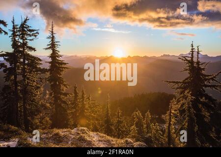 Scenic sunset on a frosty day in the Coast Mountain Range, Vancouver. Stock Photo