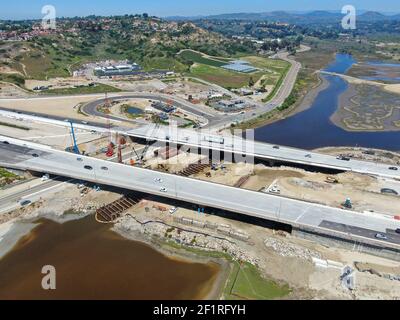 Aerial view of highway bridge construction over small river Stock Photo