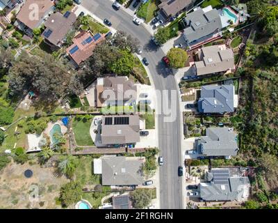 Aerial top view of upper middle class neighborhood street with residential house and swimming pool Stock Photo