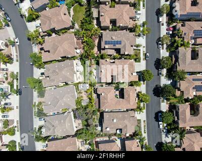 Aerial view of upper middle class neighborhood with residential houses in green valley Stock Photo