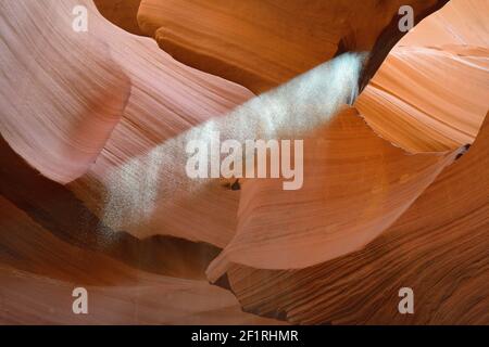 Thrown sand illuminated by a shaft of light, Lower Antelope Canyon, Hasdestwazi, LeChee Chapter, Navajo Nation, Arizona Stock Photo