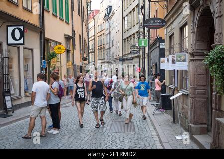 Shoppers and tourists in Österlånggatan, Gamla Stan, Stockholm, Sweden. Stock Photo