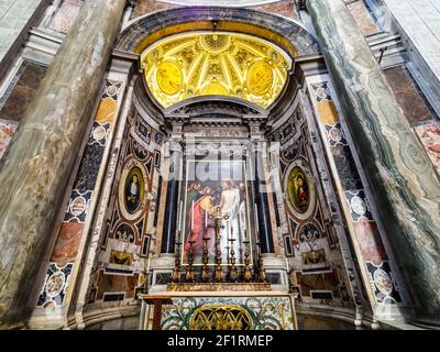 Alter of St. Thomas. The incredulity of St. Thomas. The risen Christ invites the Apostle Thomas to touch His chest wound and believe in the Resurrection. The marble sarcophagus underneath contains the relics of Pope Boniface IV (608-615) - Saint Peter Basilica, Vatican State in Rome Stock Photo