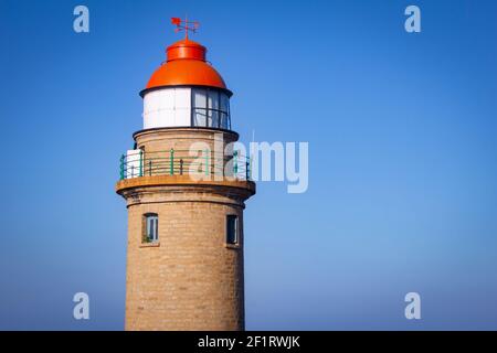 View of lighthouse from near by rock in Mahabalipuram, Tamil Nadu, India. Mahabalipuram is a town near Chennai famous for rock monuments and is a worl Stock Photo