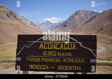 Wooden information board on viewpoint to Aconcagua Peak and landscape of Aconcagua National Park or Provoncial Park, Andes Mountains, Argentina Stock Photo
