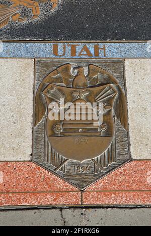 Bas relief plaque for Utah is inlaid into Hoover Dams plaza's surface, one of the seven states that fall within the Colorado River's basin. Hoover Dam Stock Photo