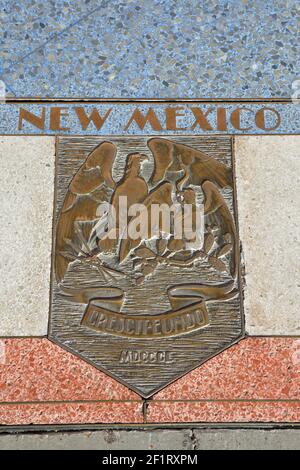 Bas relief plaque for New Mexico is inlaid into Hoover Dams plaza's surface, one of the seven states that fall within the Colorado River's basin. Hoov Stock Photo