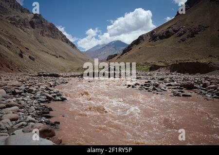 Horcones river stream in Aconcagua National Park in Andes Mountains. View to Aconcagua peak in clouds. Mendoza province, Argentina. Stock Photo