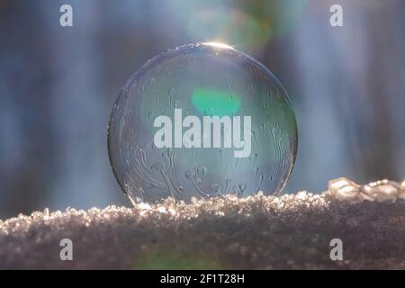 Bubbles, created in winter by the photographer, rapidly form ice crystals on the inside surfaces, Michigan, USA, Stock Photo