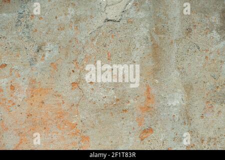 texture of an old concrete surface with chips and stains. A dilapidated, worn-out wall with a plaster base. Old vintage textures and backgrounds Stock Photo