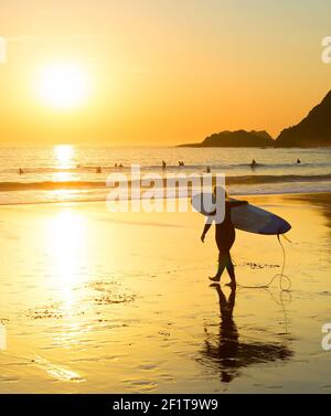 Silhouette  woman surfer beach Portugal Stock Photo
