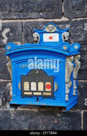 Andernach, Germany - September 26, 2018: historical mailbox in blue color from the old Prussia which is still in use for letter delivery today Stock Photo