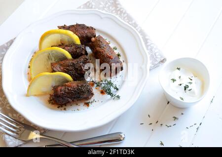 Traditional turkish dolma, sarma or dolmades. Dolmadakia or stuffed grapes leaves on white background. Traditional mediterranean dish. Stock Photo