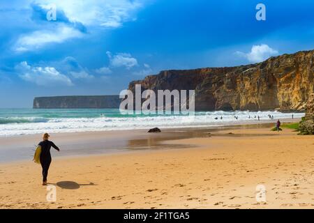 Surfer surfboard woman Portugal beach Stock Photo
