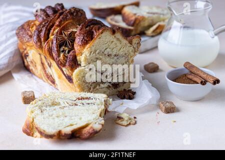 Babka or brioche bread with cinnamon and brown sugar. Homemade pastry for breakfast. Selective focus. Stock Photo