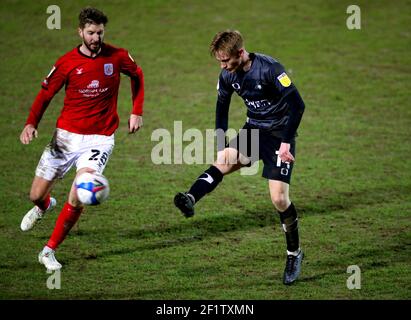 Crewe Alexandra's Luke Murphy (left) and Doncaster Rovers' Matthew Smith battle for the ball during the Sky Bet League One match at Alexandra Stadium, Crewe. Picture date: Tuesday March 9, 2021. Stock Photo