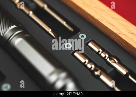 Screwdriver set tool kit close up on macro in wooden box, concept of repair Stock Photo
