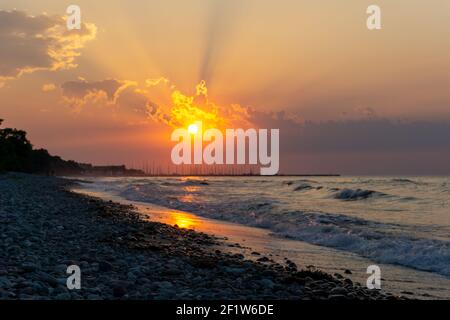 Beautiful sunset on a rocky beach on the Baltic Sea in Germany Stock Photo