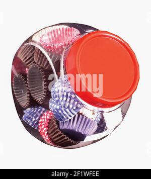Paper baskets in a glass jar, a product used by the food industry or confectioneries Stock Photo