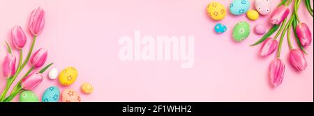 Easter - Decorated Eggs With Tulips On Pink Paper Background Stock Photo