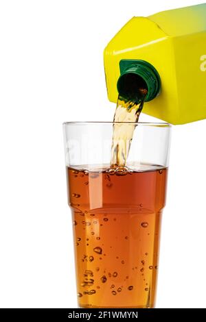 Pouring orange juice from bottle into glass Stock Photo