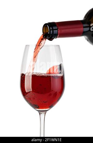 Red wine pouring in glass Stock Photo
