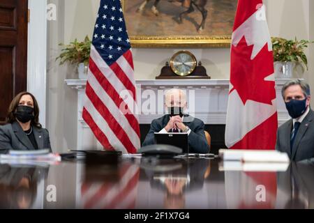 President Joe Biden and Vice President Kamala Harris, joined by Secretary of State Antony Blinken, participate in a virtual bilateral meeting with Canadian Prime Minister Justin Trudeau Tuesday, Feb. 23, 2021, in the Roosevelt Room of the White House Stock Photo