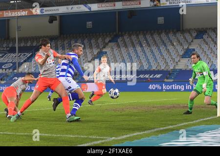 DOETINCHEM, NEDERLAND - MARCH 7: Maarten Peijenburg of FC Eindhoven Ralf Seuntjens of De Graafschap goalkeeper Ruud Swinkels of FC Eindhoven during th Stock Photo