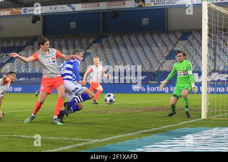 DOETINCHEM, NEDERLAND - MARCH 7: Maarten Peijenburg of FC Eindhoven Ralf Seuntjens of De Graafschap goalkeeper Ruud Swinkels of FC Eindhoven during th Stock Photo