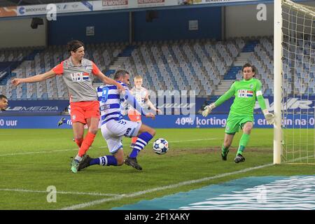 DOETINCHEM, NEDERLAND - MARCH 7: Maarten Peijenburg of FC Eindhoven Ralf Seuntjens of De Graafschap goalkeeper Ruud Swinkels of FC Eindhoven during th Stock Photo