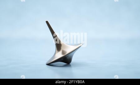 Spinning top on a table Stock Photo