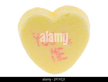 Yellow with red letters - Valentine tiny conversation sugar heart - you & me - macro extreme detail for Valentine's Day Stock Photo