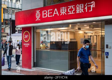 Hong Kong, China. 09th Mar, 2021. A pedestrian walks past the Bank of East Asia (BEA) branch and logo seen in Hong Kong. Credit: SOPA Images Limited/Alamy Live News Stock Photo