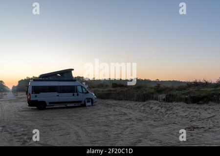 Camper van parked on a beach Stock Photo - Alamy