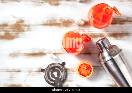 Orange cocktails with a place for text, overhead flat lay shot with a shaker Stock Photo