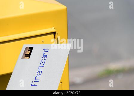 Mailbox and letter to the tax office Stock Photo