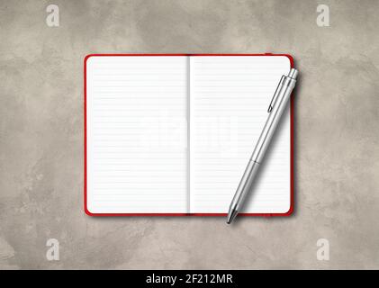 Red open lined notebook mockup with a pen isolated on concrete background Stock Photo