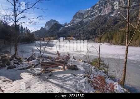 Germany, Bavaria, Berchtesgaden, Berchtesgadener Alps, Partially snow covered and frozen Lake Hintersee. Stock Photo