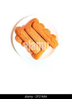 Sweet soft healthy soft spongy sprinkled sugar vanilla cookies (vainillas). Classic Argentine biscuits. White background. Overhead shot. Copyspace Stock Photo