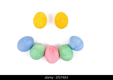 Easter eggs smile face. Multi-colored eggs making a smile face isolated on a white background. Preparation for the Easter holiday Stock Photo