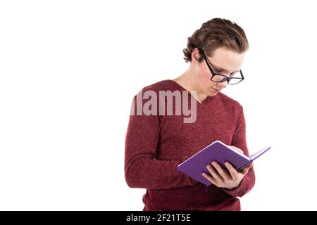 Student on a white background. Young attractive guy listens to music. Stock Photo