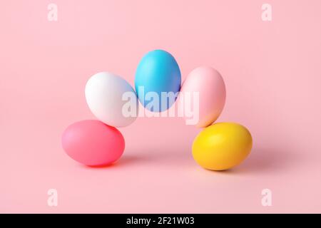composition of easter eggs over pink background Stock Photo