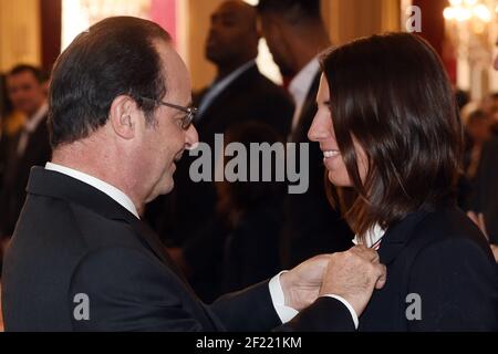 French President Francois Hollande (L) awards the Legion of Honour (Legion d'Honneur) to Olympic Sailing champion Charline Picon at the Elysee Presidential Palace in Paris, France, on December 1, 2016 - Photo Philippe Millereau / KMSP / DPPI Stock Photo