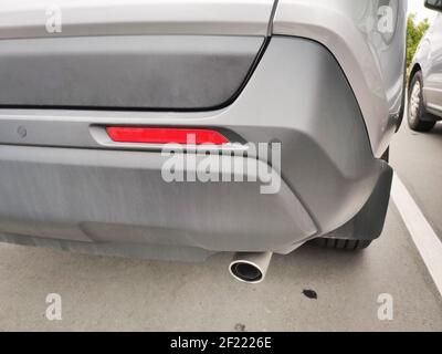 Back of a car with an exhaust pipe Stock Photo